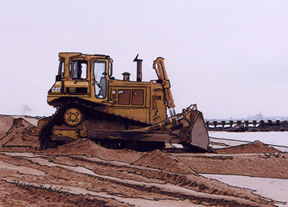 bulldozer spreads sand at Laurence Harbor, NJ